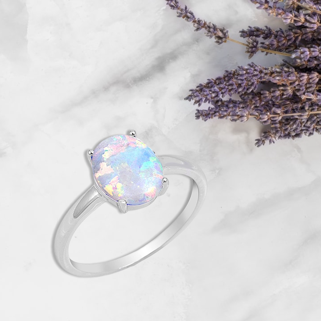 Oxford Diamond Co Solid Oval Lab Created White Opal .925 Sterling Silver Ring