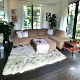 Tan colored sectional with ottoman