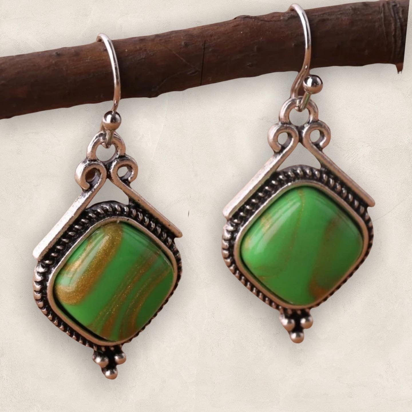 Green geometric dangle earrings