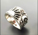 Silver plated sun and moon engraved ring. Size 8.