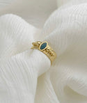 Turquoise gold coated oval decor ring. Size 8.