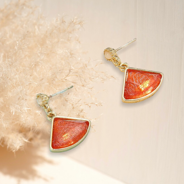 Red-orange charm drop earrings