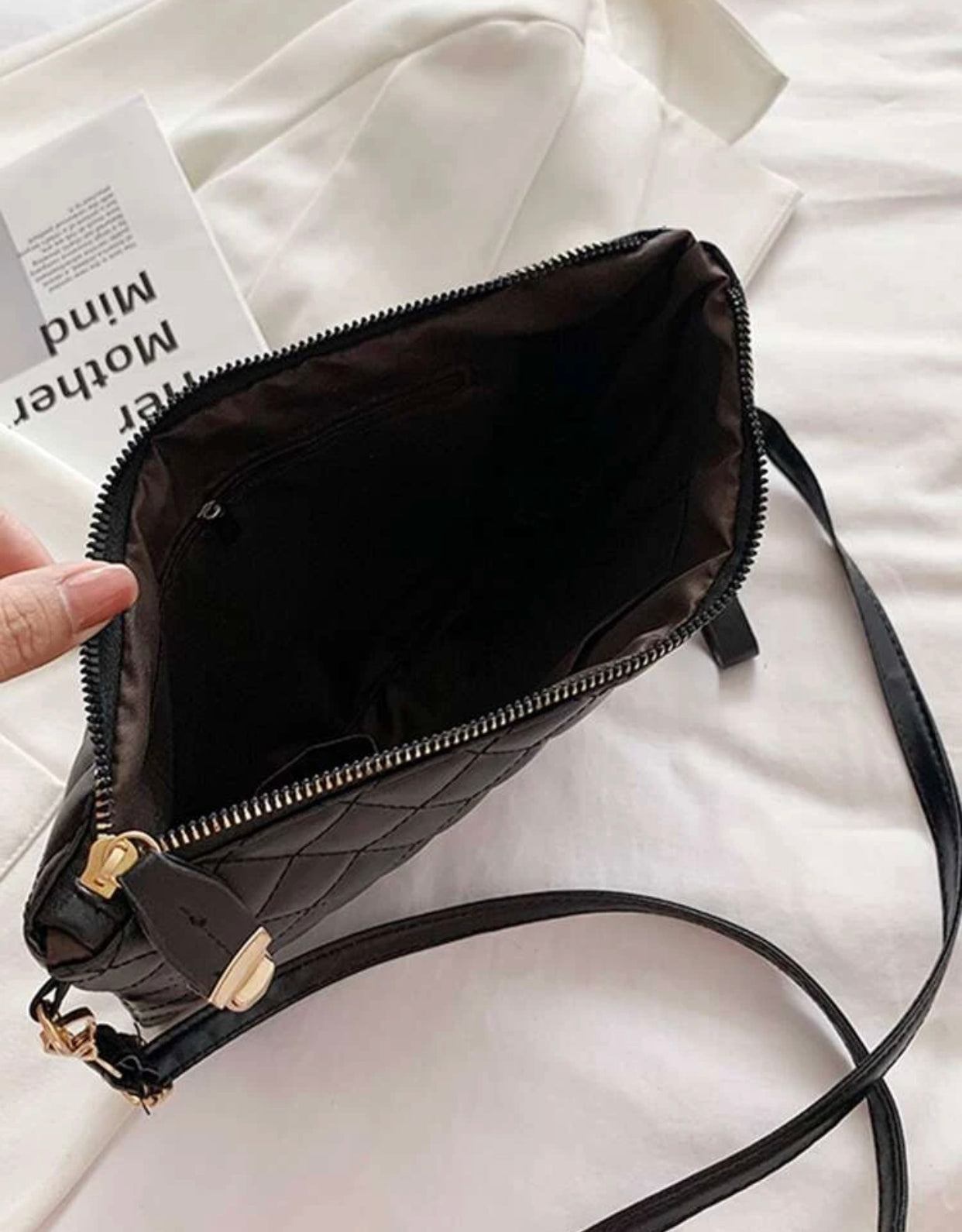 Quilted embossed zip crossbody bag