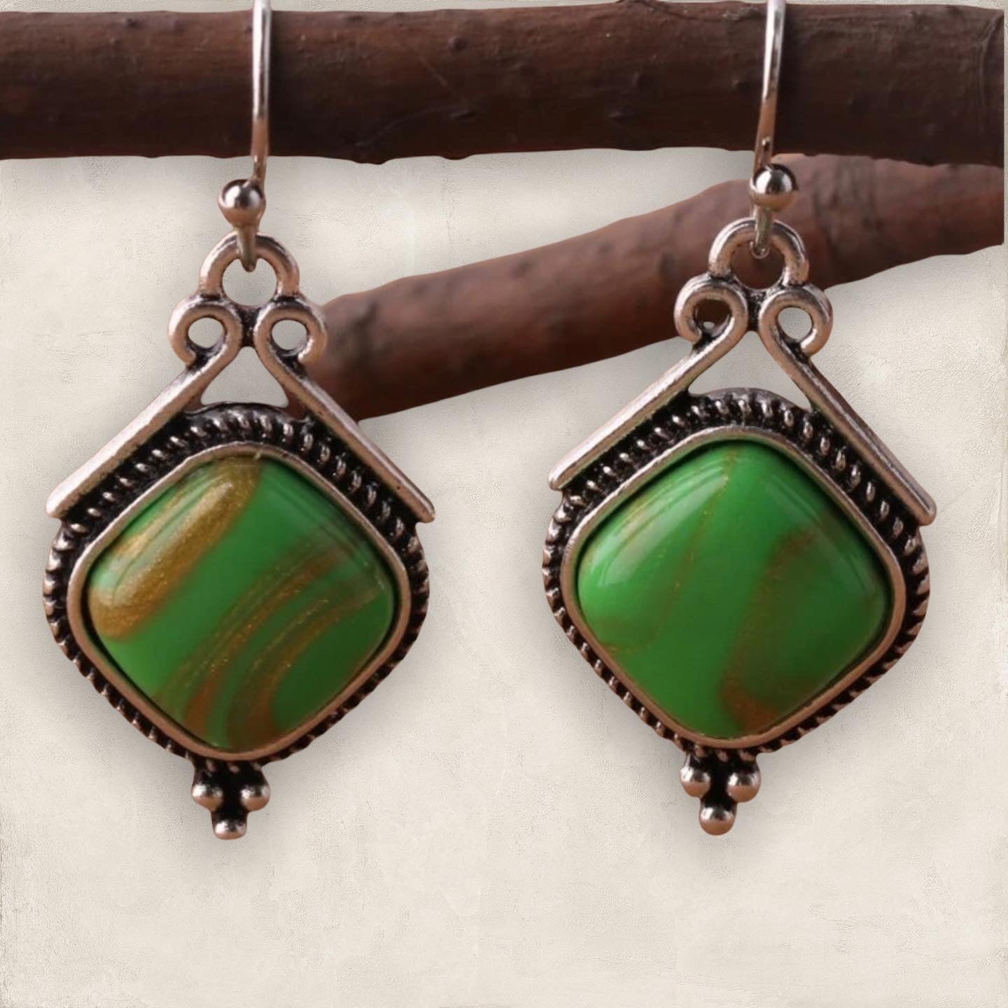 Green geometric dangle earrings