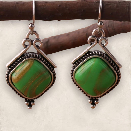 Green geometric dangle earrings