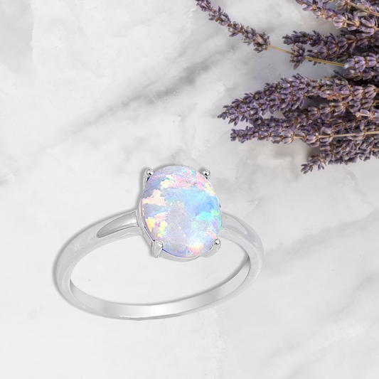 Oxford Diamond Co Solid Oval Lab Created White Opal .925 Sterling Silver Ring