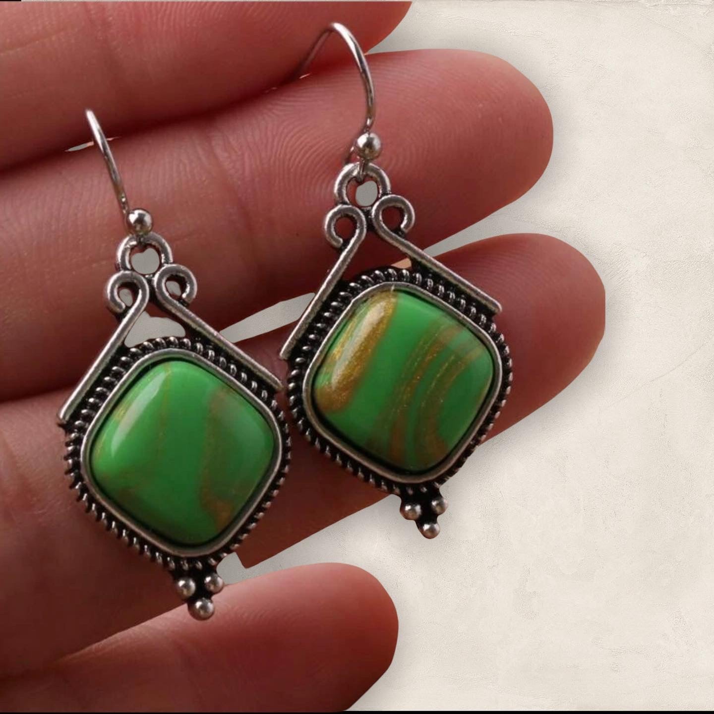 Green geometric dangle earrings