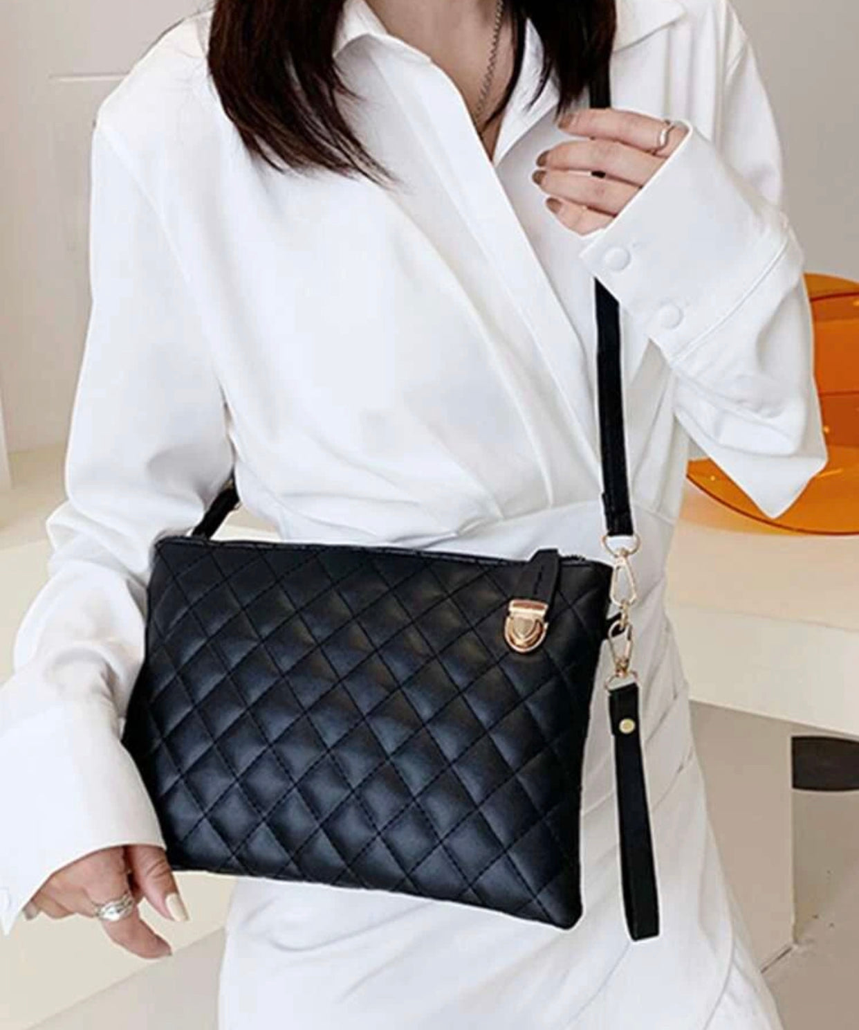 Quilted embossed zip crossbody bag