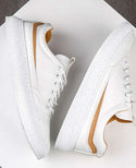 Men’s white and beige textured lace-up front skate shoes