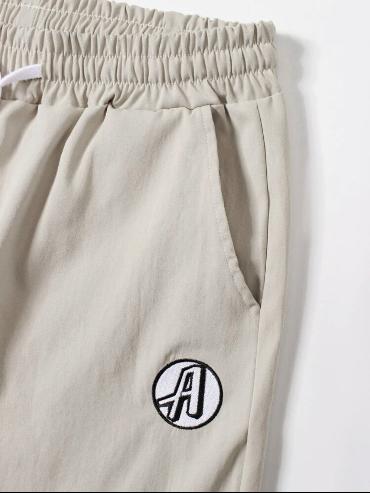 Men’s embroidered letter drawstring carrot pants