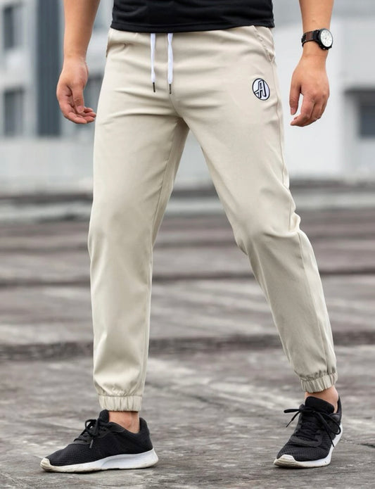 Men’s embroidered letter drawstring carrot pants