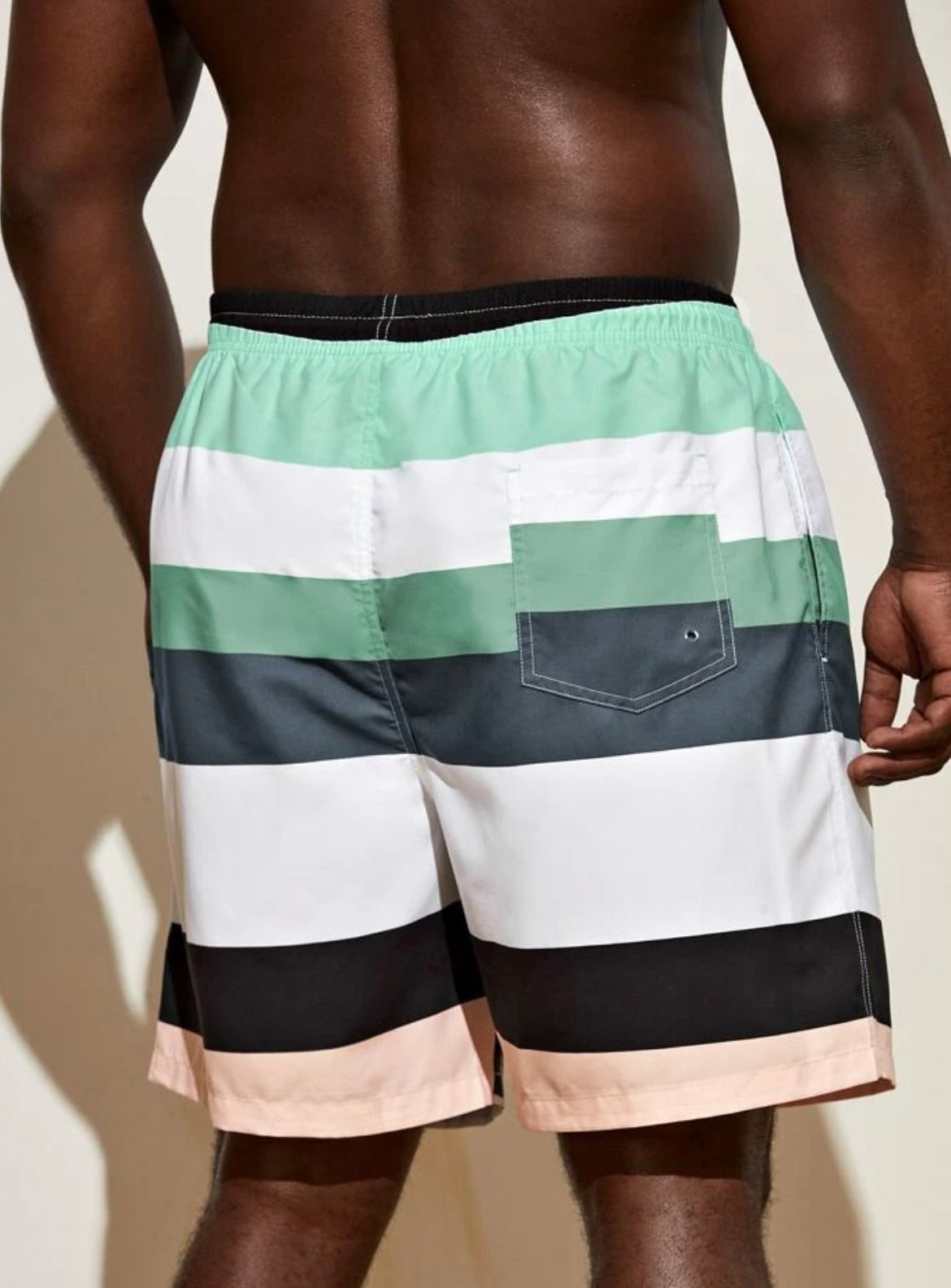 Extended sizes men coconut tree and figure graphic colorblock drawstring waist swim trunks